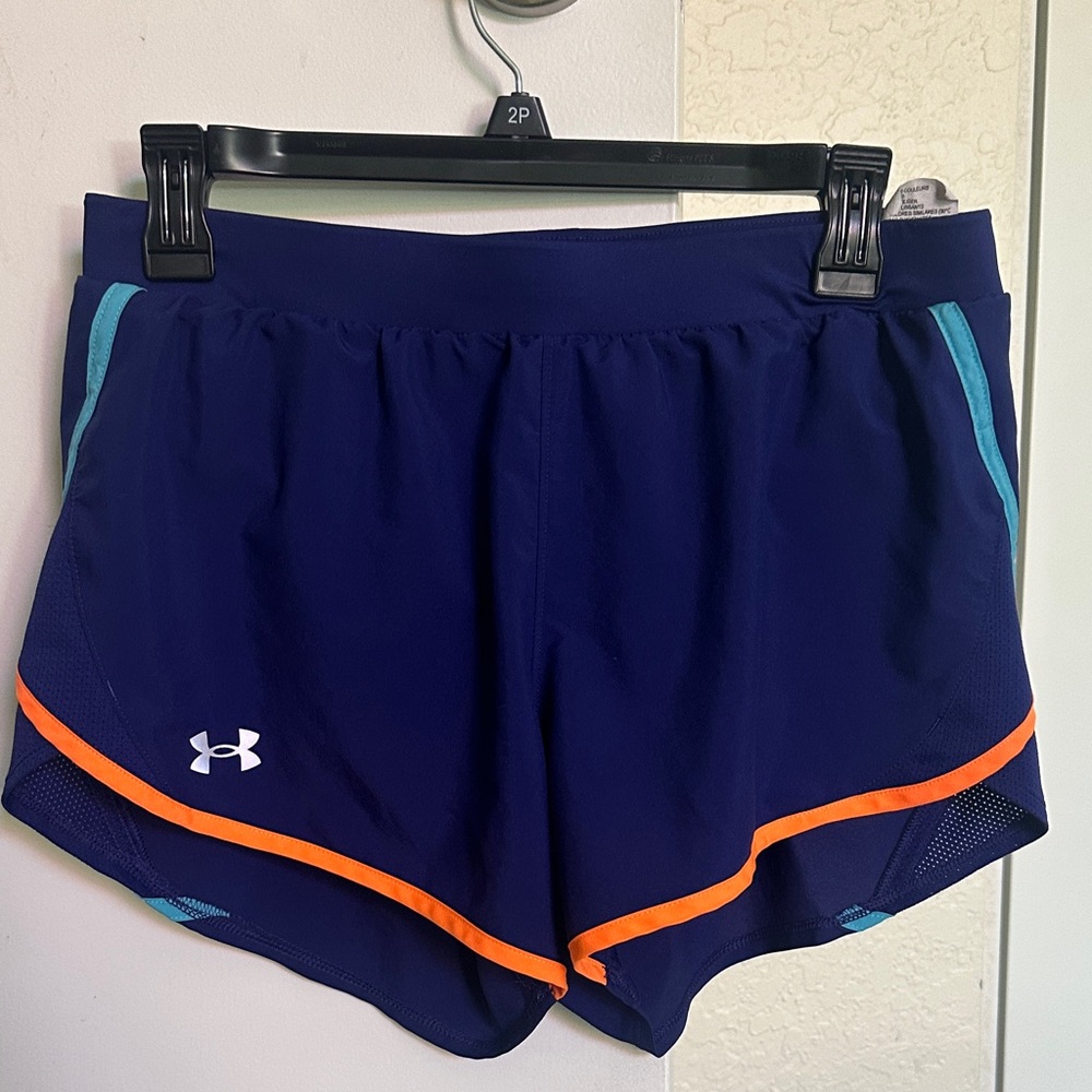 Under Armour Women's Blue Athletic Shorts with Orange Trim and built in liner